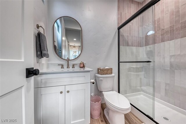 365 Crown Mesa Ave, Las Vegas, NV 89138 - full bath featuring toilet, a shower stall, vanity, and wood finished floors