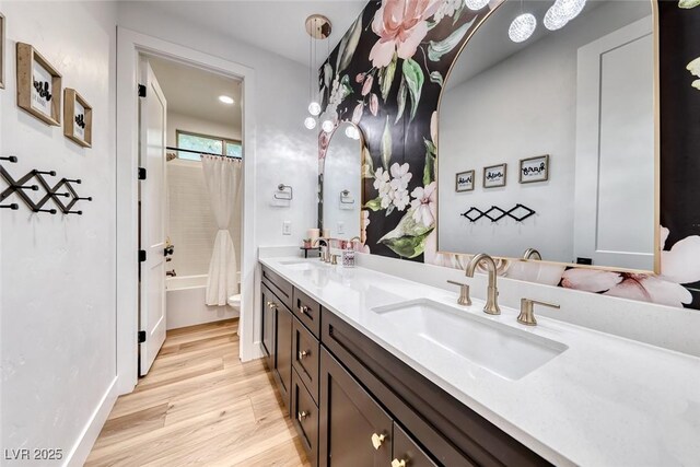 365 Crown Mesa Ave, Las Vegas, NV 89138 - full bathroom with double vanity, wood finished floors, shower / tub combo with curtain, and toilet