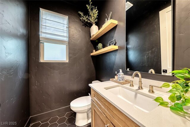 365 Crown Mesa Ave, Las Vegas, NV 89138 - half bathroom featuring vanity, toilet, tile patterned flooring, and baseboards