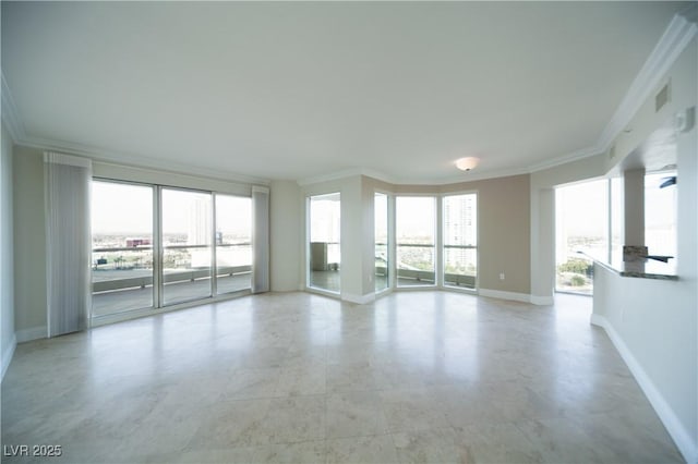 2777 Paradise Rd Unit 1505, Las Vegas, NV 89109 - unfurnished living room with ornamental molding and baseboards