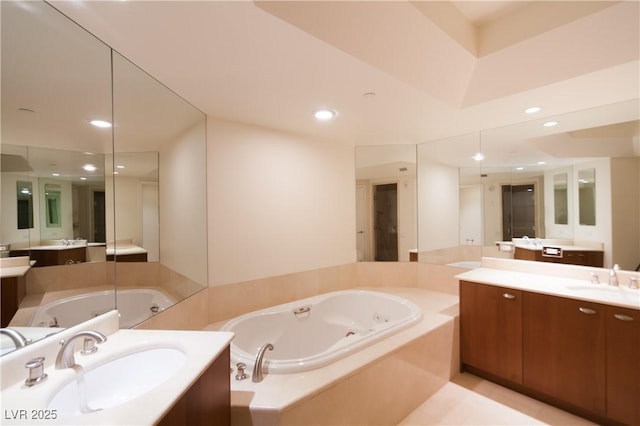 2777 Paradise Rd Unit 1505, Las Vegas, NV 89109 - full bathroom with a whirlpool tub, two vanities, and recessed lighting