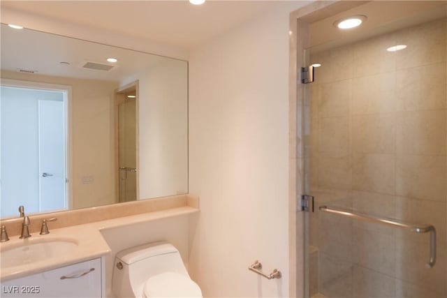 2777 Paradise Rd Unit 1505, Las Vegas, NV 89109 - full bath with vanity, a stall shower, recessed lighting, and toilet