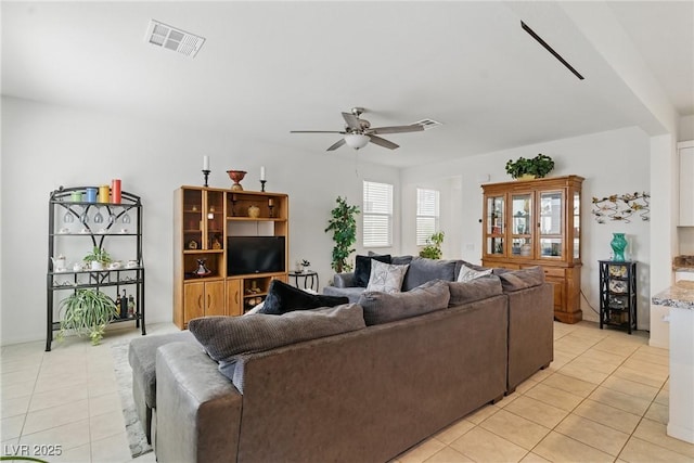 6322 Angora Peak Ln, Las Vegas, NV 89115 - living room with light tile patterned floors and ceiling fan