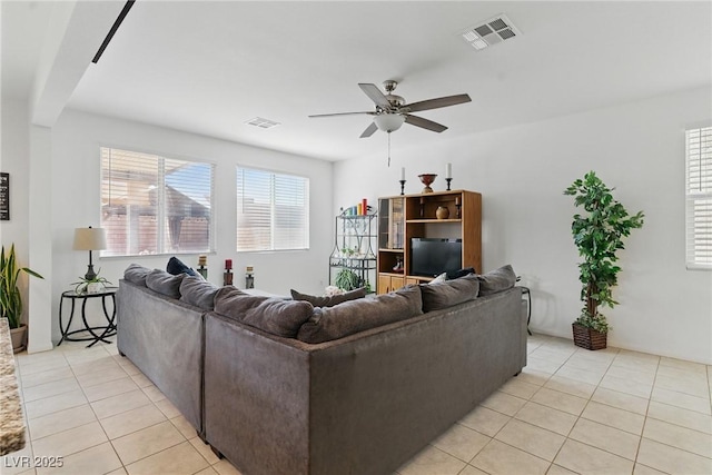 6322 Angora Peak Ln, Las Vegas, NV 89115 - living room with a ceiling fan and light tile patterned floors