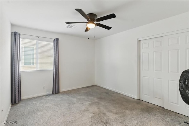 6322 Angora Peak Ln, Las Vegas, NV 89115 - unfurnished bedroom with carpet flooring, baseboards, a closet, and a ceiling fan