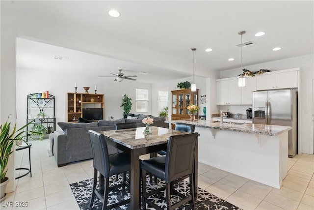 6322 Angora Peak Ln, Las Vegas, NV 89115 - dining area with recessed lighting, light tile patterned flooring, and ceiling fan