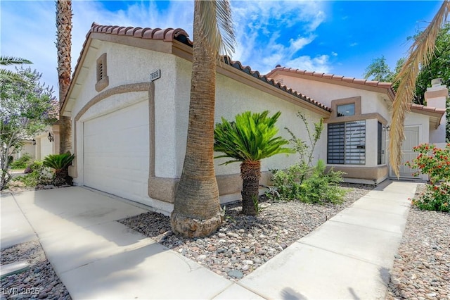 7865 March Brown Ave, Las Vegas, NV 89149 - view of front of property featuring an attached garage, stucco siding, concrete driveway, and a tile roof