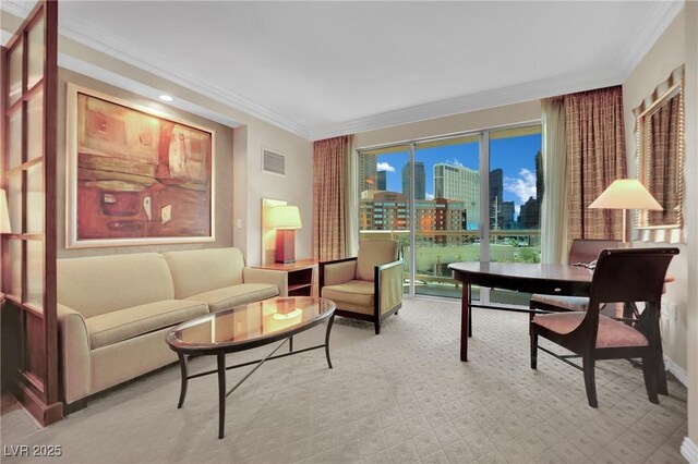 135 E Harmon Ave Unit 315, Las Vegas, NV 89109 - living room featuring crown molding, a city view, and baseboards