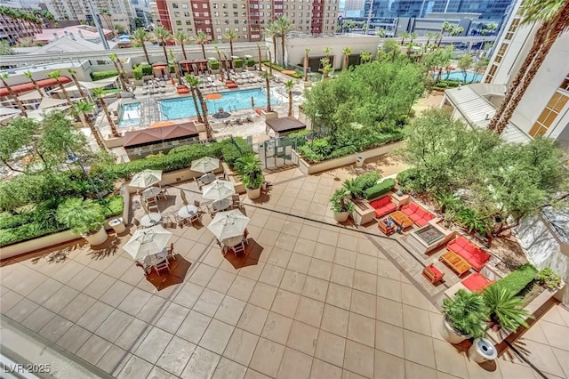 135 E Harmon Ave Unit 315, Las Vegas, NV 89109 - view of patio / terrace with a view of city and a community pool