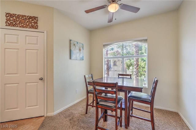 6480 Annie Oakley Dr Unit 624, Las Vegas, NV 89120 - dining room featuring light carpet, a ceiling fan, and baseboards
