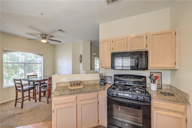 6480 Annie Oakley Dr Unit 624, Las Vegas, NV 89120 - kitchen featuring black appliances, light brown cabinetry, a peninsula, ceiling fan, and light carpet