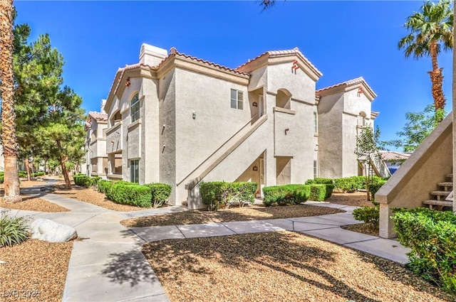6480 Annie Oakley Dr Unit 624, Las Vegas, NV 89120 - view of building exterior featuring stairway
