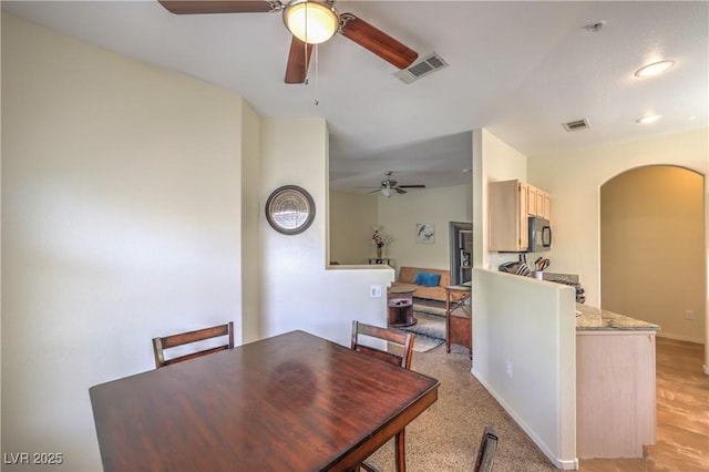 6480 Annie Oakley Dr Unit 624, Las Vegas, NV 89120 - dining room with ceiling fan and arched walkways