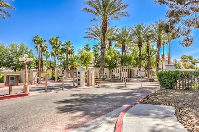 6480 Annie Oakley Dr Unit 624, Las Vegas, NV 89120 - view of decorative street with a gate, curbs, and a gated entry