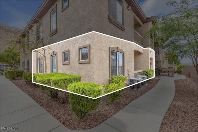 3544 Desert Cliff St Unit 102, Las Vegas, NV 89129 - view of side of property with stucco siding and central AC unit