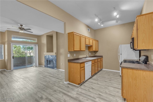3544 Desert Cliff St Unit 102, Las Vegas, NV 89129 - kitchen with white dishwasher, light wood-style flooring, and baseboards