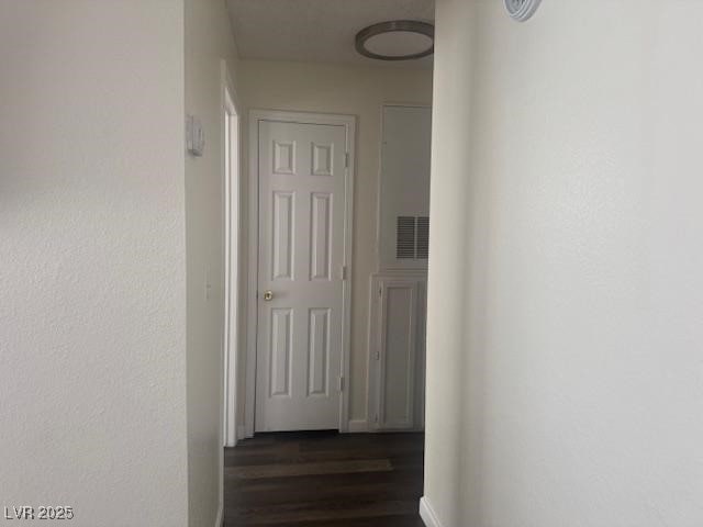 2108 Willowbury Dr Unit B, Las Vegas, NV 89108 - hall featuring dark wood-style floors and baseboards