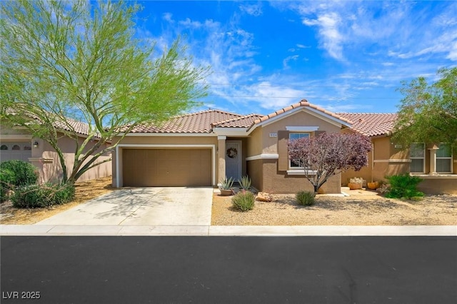 9104 Ashiwi Ave, Las Vegas, NV 89178 - view of front of home with a garage, stucco siding, driveway, and a tile roof