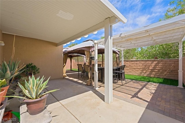 9104 Ashiwi Ave, Las Vegas, NV 89178 - fenced backyard with a gazebo, outdoor dining area, a pergola, and a patio