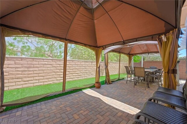9104 Ashiwi Ave, Las Vegas, NV 89178 - fenced backyard featuring a gazebo, outdoor dining area, and a patio