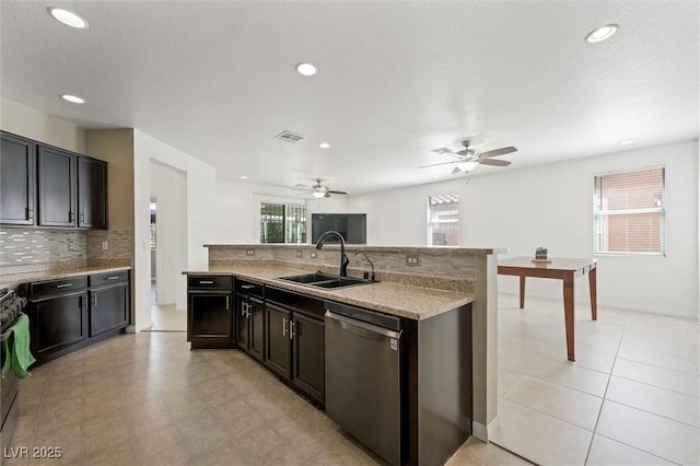 9104 Ashiwi Ave, Las Vegas, NV 89178 - kitchen featuring stainless steel dishwasher, a sink, backsplash, recessed lighting, and a ceiling fan