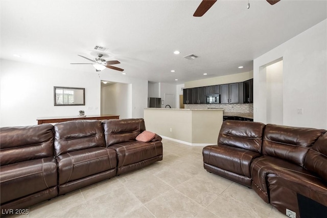 9104 Ashiwi Ave, Las Vegas, NV 89178 - living area featuring ceiling fan, light tile patterned floors, and recessed lighting