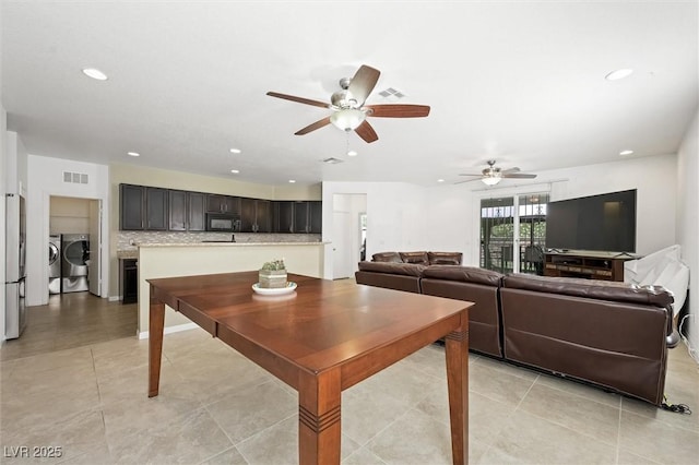 9104 Ashiwi Ave, Las Vegas, NV 89178 - living area with washing machine and clothes dryer, ceiling fan, recessed lighting, and light tile patterned flooring