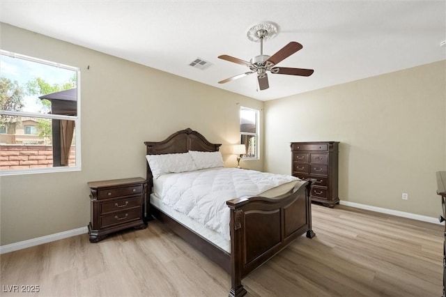 9104 Ashiwi Ave, Las Vegas, NV 89178 - bedroom featuring light wood-type flooring, baseboards, and ceiling fan
