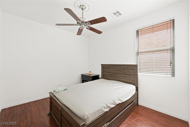 9104 Ashiwi Ave, Las Vegas, NV 89178 - bedroom with baseboards, wood finished floors, and a ceiling fan