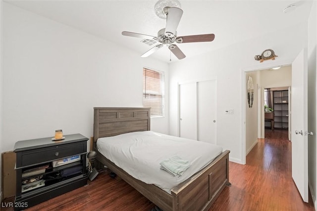 9104 Ashiwi Ave, Las Vegas, NV 89178 - bedroom featuring wood finished floors, a closet, a ceiling fan, and baseboards