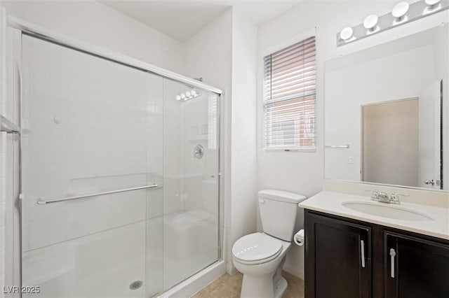 9104 Ashiwi Ave, Las Vegas, NV 89178 - bathroom featuring toilet, vanity, a stall shower, baseboards, and tile patterned floors