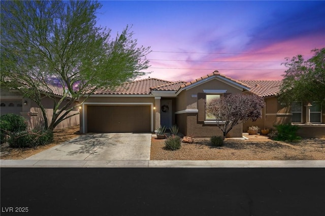 9104 Ashiwi Ave, Las Vegas, NV 89178 - mediterranean / spanish-style house with a garage, a tiled roof, stucco siding, and concrete driveway