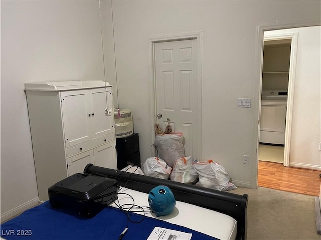 5334 Floating Flower Ave, Las Vegas, NV 89139 - bedroom featuring washer / clothes dryer, baseboards, and light carpet