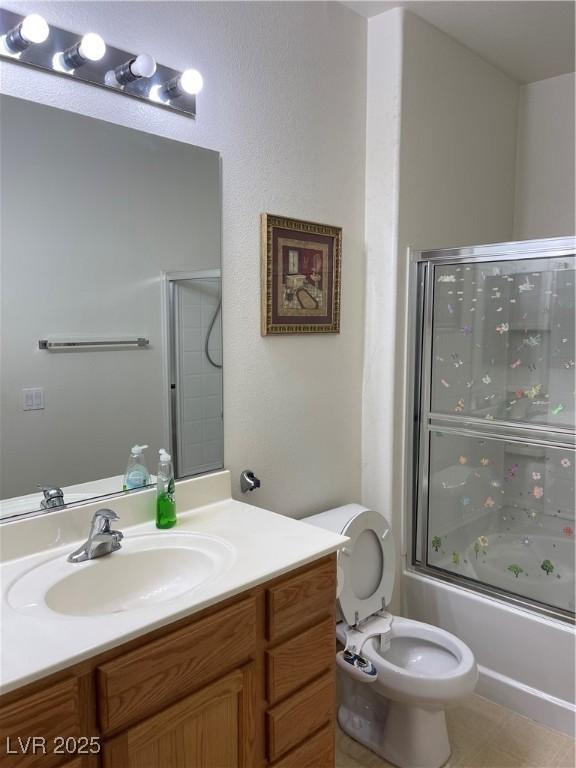 5334 Floating Flower Ave, Las Vegas, NV 89139 - full bath with vanity, toilet, and shower / bath combination with glass door