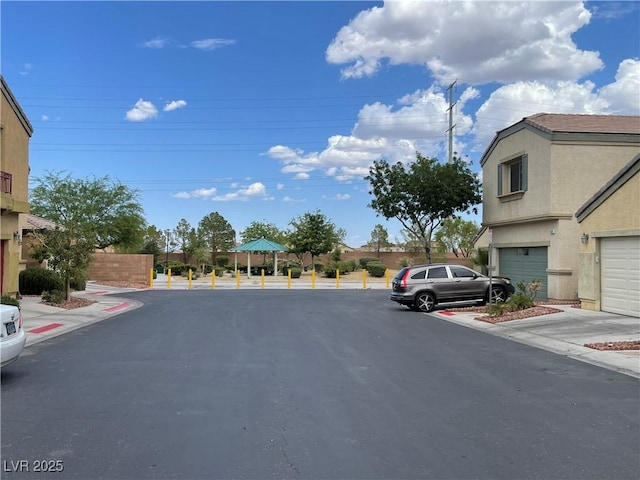 5334 Floating Flower Ave, Las Vegas, NV 89139 - view of asphalt road featuring curbs and sidewalks