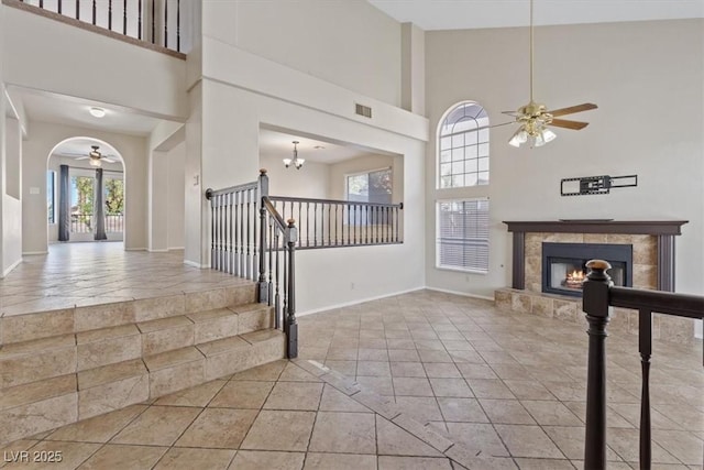 2812 Via Avanti St, Henderson, NV 89074 - foyer entrance with a ceiling fan, plenty of natural light, a towering ceiling, a fireplace, and baseboards