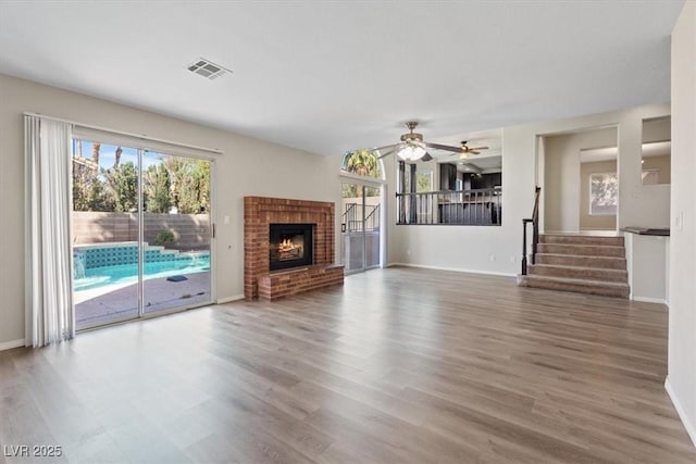 2812 Via Avanti St, Henderson, NV 89074 - unfurnished living room with wood finished floors, baseboards, and a ceiling fan