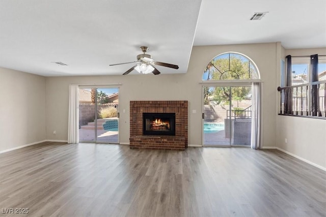 2812 Via Avanti St, Henderson, NV 89074 - unfurnished living room with plenty of natural light, wood finished floors, ceiling fan, and baseboards