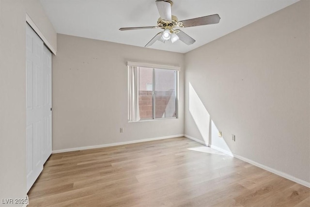 2812 Via Avanti St, Henderson, NV 89074 - unfurnished bedroom featuring light wood-style floors, a closet, baseboards, and ceiling fan