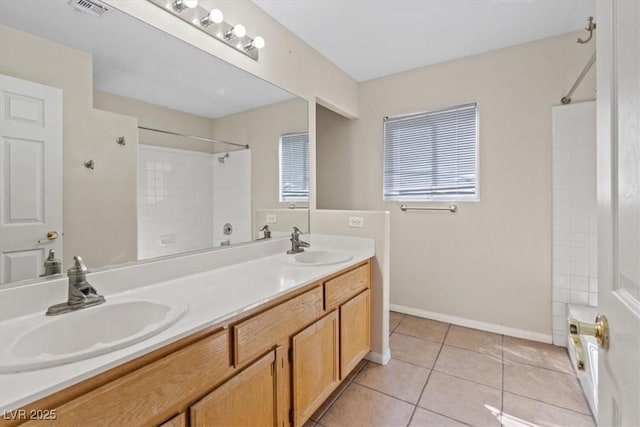 2812 Via Avanti St, Henderson, NV 89074 - full bath featuring double vanity, bathing tub / shower combination, tile patterned floors, and baseboards