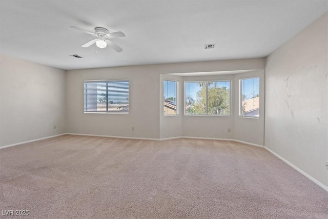 2812 Via Avanti St, Henderson, NV 89074 - empty room featuring light carpet, ceiling fan, and baseboards