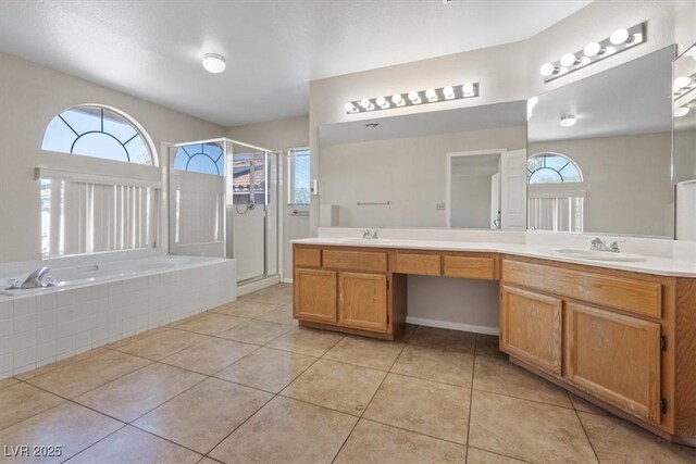 2812 Via Avanti St, Henderson, NV 89074 - bathroom with healthy amount of natural light, double vanity, a stall shower, and a bath
