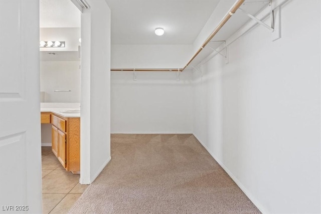 2812 Via Avanti St, Henderson, NV 89074 - spacious closet featuring light carpet and light tile patterned floors