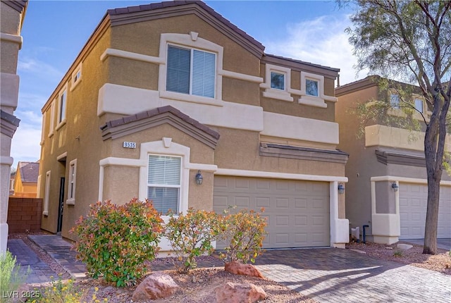 9535 Stills Way, Las Vegas, NV 89148 - view of front of property with an attached garage, decorative driveway, and stucco siding