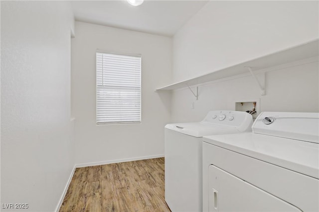 9535 Stills Way, Las Vegas, NV 89148 - laundry room with washer and clothes dryer, light wood-type flooring, and baseboards