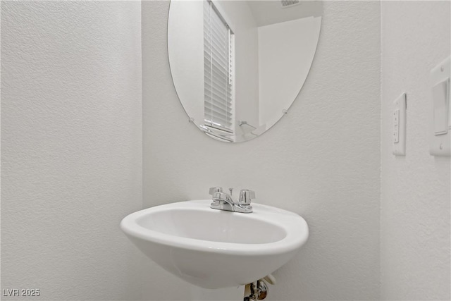 9535 Stills Way, Las Vegas, NV 89148 - bathroom featuring a textured wall and a sink