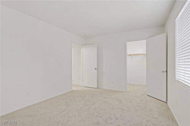 9535 Stills Way, Las Vegas, NV 89148 - unfurnished bedroom featuring light colored carpet, a spacious closet, and baseboards