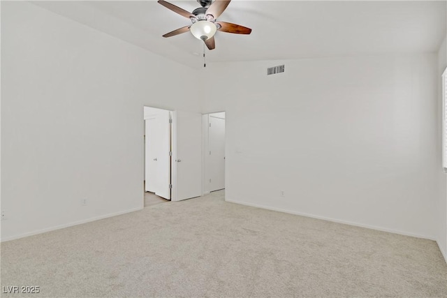 9535 Stills Way, Las Vegas, NV 89148 - empty room featuring light colored carpet, ceiling fan, lofted ceiling, and baseboards