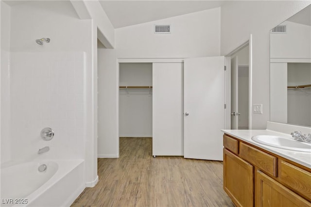 9535 Stills Way, Las Vegas, NV 89148 - full bathroom with vanity, wood finished floors, shower / bath combination, and a walk in closet