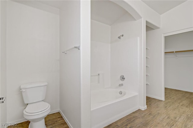 9535 Stills Way, Las Vegas, NV 89148 - bathroom featuring toilet, bathing tub / shower combination, wood finished floors, and baseboards